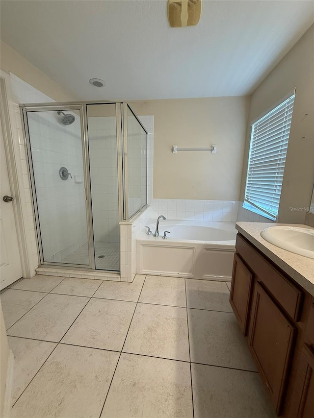 7198 Cedarcrest Blvd, Lakeland, FL 33810 - bathroom featuring a bath, a shower stall, vanity, and tile patterned flooring