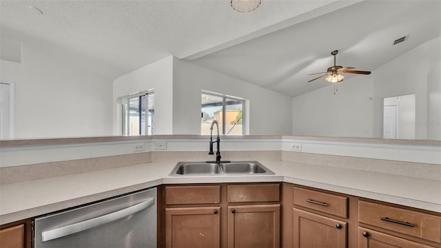 3917 NW Warbler Dr, Winter Haven, FL 33880 - kitchen featuring lofted ceiling, dishwasher, light countertops, ceiling fan, and brown cabinets