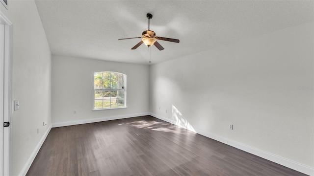 3917 NW Warbler Dr, Winter Haven, FL 33880 - empty room featuring ceiling fan, dark wood-style flooring, and a textured ceiling