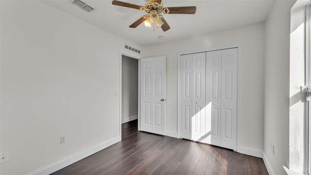 3917 NW Warbler Dr, Winter Haven, FL 33880 - unfurnished bedroom featuring dark wood-style floors, a closet, and ceiling fan