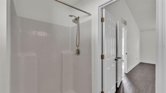 3917 NW Warbler Dr, Winter Haven, FL 33880 - bathroom featuring a shower stall and wood finished floors