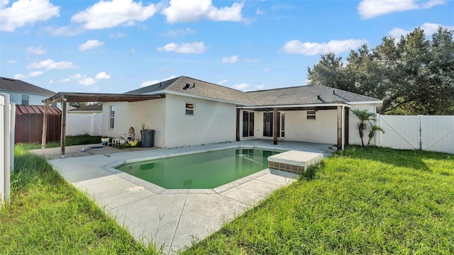 3917 NW Warbler Dr, Winter Haven, FL 33880 - rear view of property featuring a patio area, stucco siding, a fenced backyard, and a gate