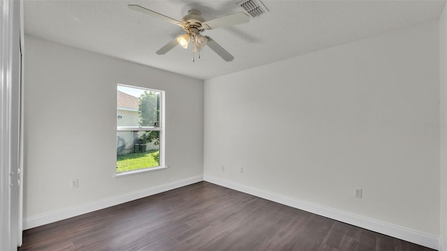 3917 NW Warbler Dr, Winter Haven, FL 33880 - spare room featuring dark wood-style flooring and a ceiling fan