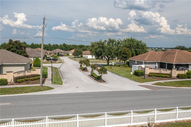 702 Country Walk Cv, Eagle Lake, FL 33839 - view of asphalt street featuring curbs, sidewalks, and a residential view