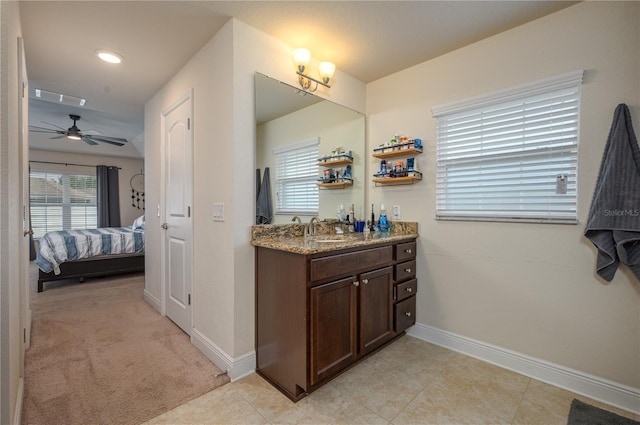 702 Country Walk Cv, Eagle Lake, FL 33839 - ensuite bathroom featuring vanity, a ceiling fan, and tile patterned flooring