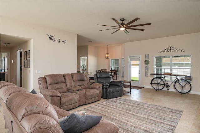 702 Country Walk Cv, Eagle Lake, FL 33839 - living area featuring light tile patterned floors and ceiling fan