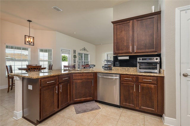 702 Country Walk Cv, Eagle Lake, FL 33839 - kitchen featuring dishwasher, a peninsula, light tile patterned flooring, and light stone counters