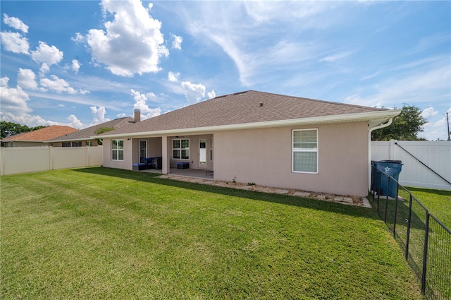 702 Country Walk Cv, Eagle Lake, FL 33839 - back of house with stucco siding, a patio area, a fenced backyard, a shingled roof, and a chimney