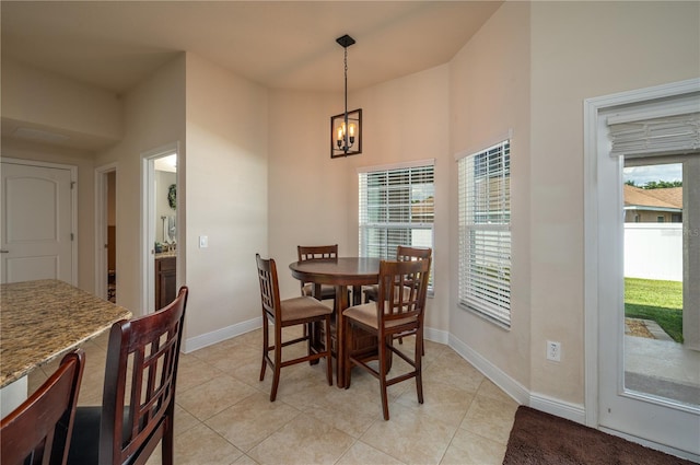 702 Country Walk Cv, Eagle Lake, FL 33839 - dining area with a chandelier and light tile patterned flooring