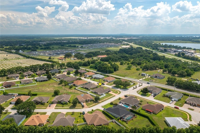 702 Country Walk Cv, Eagle Lake, FL 33839 - aerial view of residential area with a large body of water