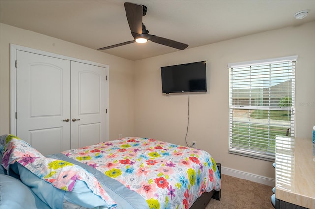 702 Country Walk Cv, Eagle Lake, FL 33839 - bedroom featuring carpet floors, a closet, and ceiling fan