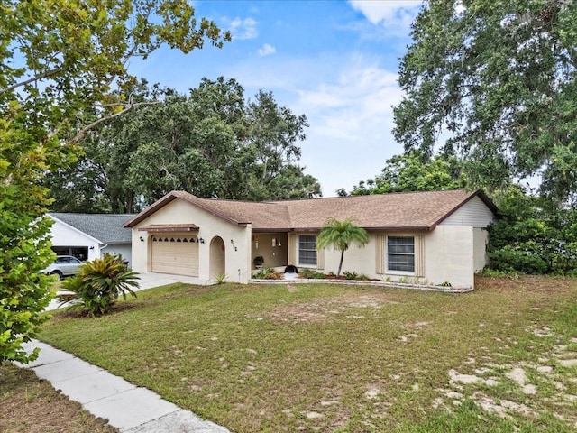 512 Hilldale Rd, Brandon, FL 33510 - single story home featuring an attached garage, a front yard, stucco siding, and concrete driveway