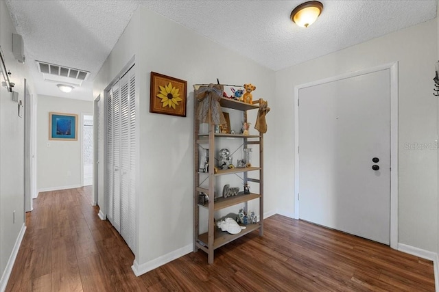 512 Hilldale Rd, Brandon, FL 33510 - foyer entrance with wood finished floors and a textured ceiling