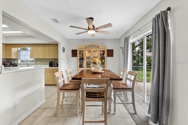 512 Hilldale Rd, Brandon, FL 33510 - dining space with ceiling fan, light tile patterned floors, and a textured ceiling