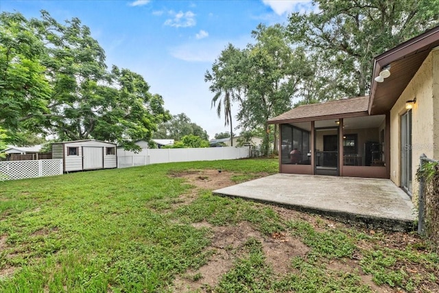 512 Hilldale Rd, Brandon, FL 33510 - fenced backyard featuring a sunroom, a patio, and a storage unit