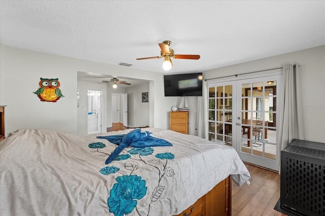 512 Hilldale Rd, Brandon, FL 33510 - bedroom with french doors, wood finished floors, ceiling fan, and a textured ceiling