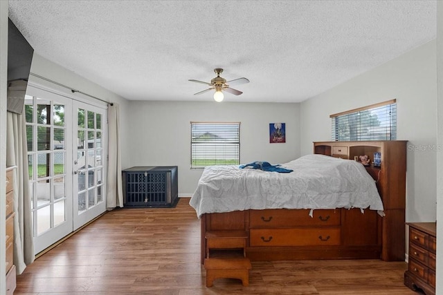 512 Hilldale Rd, Brandon, FL 33510 - bedroom with multiple windows, access to outside, wood finished floors, french doors, and a textured ceiling