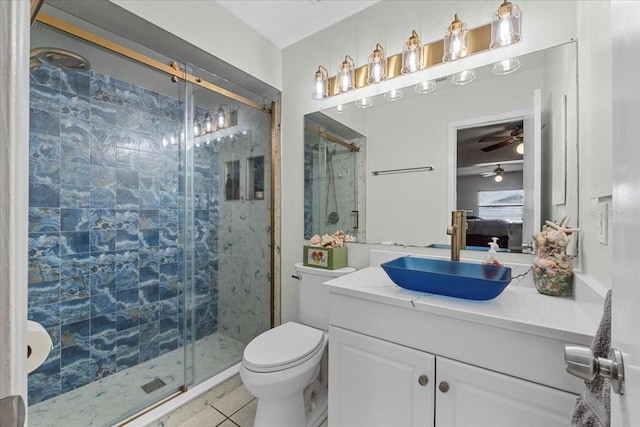 512 Hilldale Rd, Brandon, FL 33510 - ensuite bathroom featuring a shower stall, a ceiling fan, vanity, and tile patterned floors