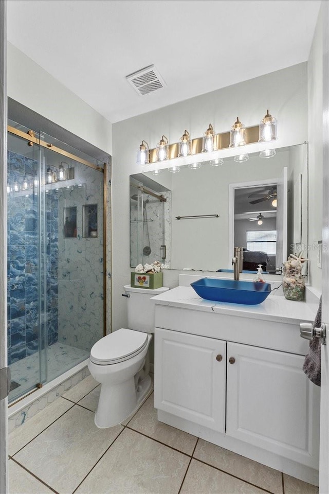 512 Hilldale Rd, Brandon, FL 33510 - bathroom featuring tile patterned flooring, vanity, a stall shower, and a ceiling fan