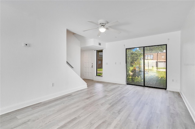 1836 N Crystal Lake Dr Unit 11, Lakeland, FL 33801 - spare room with a ceiling fan and light wood-style floors