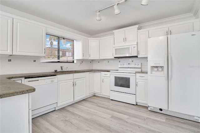 1836 N Crystal Lake Dr Unit 11, Lakeland, FL 33801 - kitchen featuring white appliances, white cabinetry, and light wood finished floors