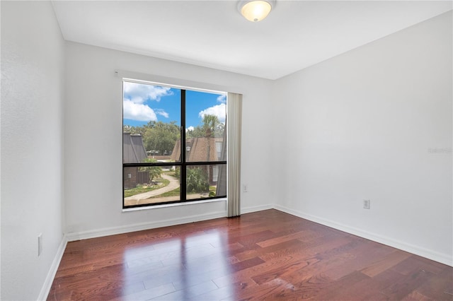 1836 N Crystal Lake Dr Unit 11, Lakeland, FL 33801 - spare room with wood finished floors