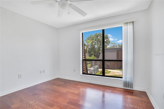 1836 N Crystal Lake Dr Unit 11, Lakeland, FL 33801 - empty room with wood finished floors and a ceiling fan