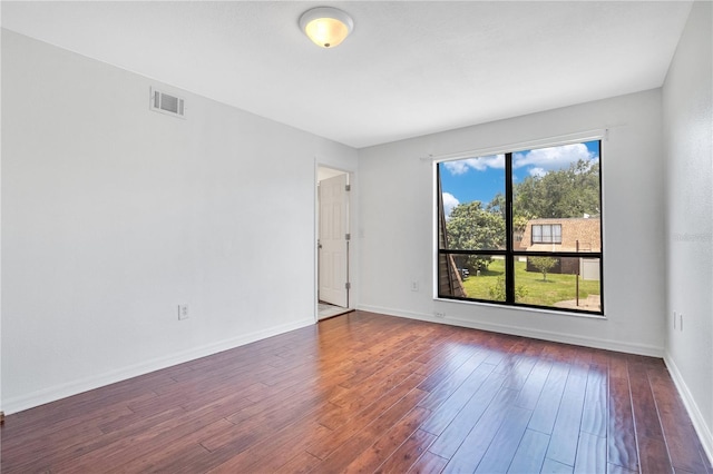 1836 N Crystal Lake Dr Unit 11, Lakeland, FL 33801 - unfurnished room with hardwood / wood-style flooring and baseboards