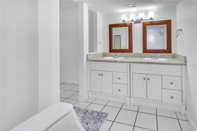 1836 N Crystal Lake Dr Unit 11, Lakeland, FL 33801 - full bathroom with double vanity and tile patterned floors