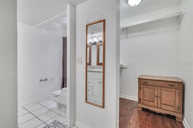 1836 N Crystal Lake Dr Unit 11, Lakeland, FL 33801 - full bathroom with vanity and wood finished floors
