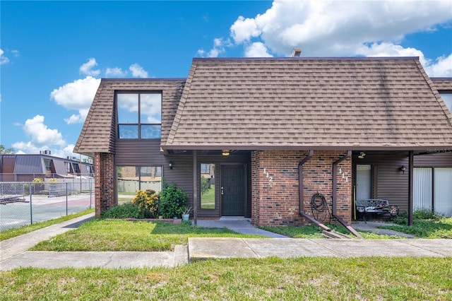 1836 N Crystal Lake Dr Unit 11, Lakeland, FL 33801 - front of property with brick siding and a shingled roof