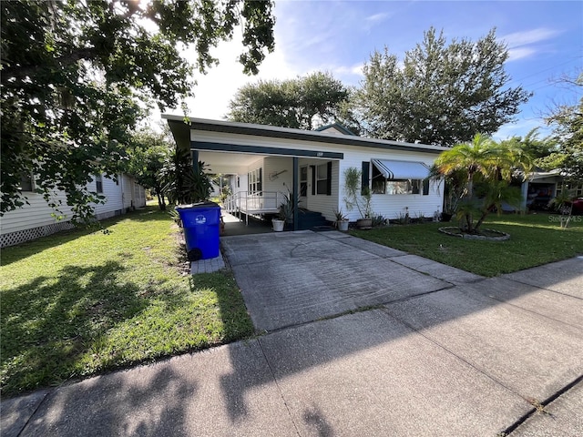 1319 Florida Ave, Saint Cloud, FL 34769 - view of front of property with concrete driveway and a front lawn