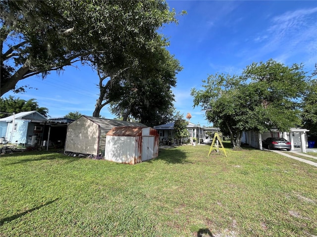 1319 Florida Ave, Saint Cloud, FL 34769 - view of green lawn with a storage unit