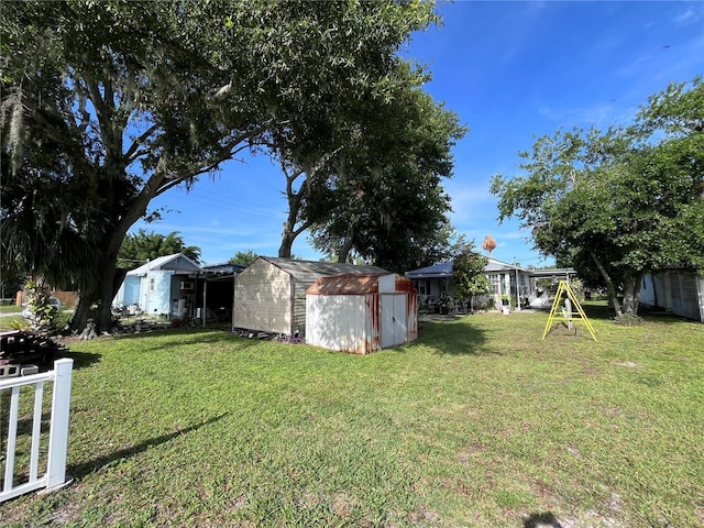 1319 Florida Ave, Saint Cloud, FL 34769 - view of grassy yard with a storage shed