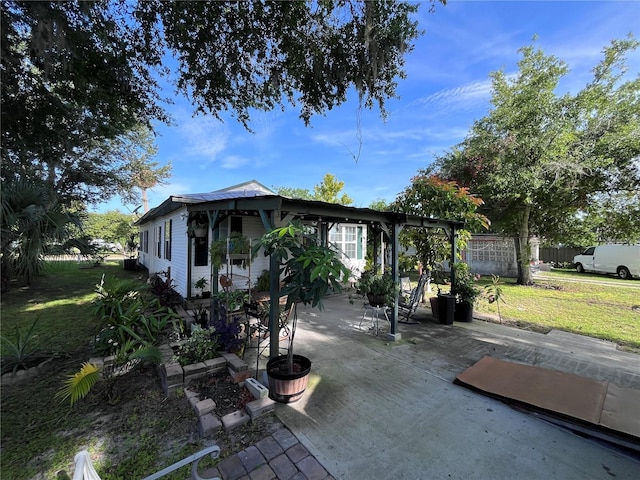 1319 Florida Ave, Saint Cloud, FL 34769 - view of side of home with a patio area and a yard