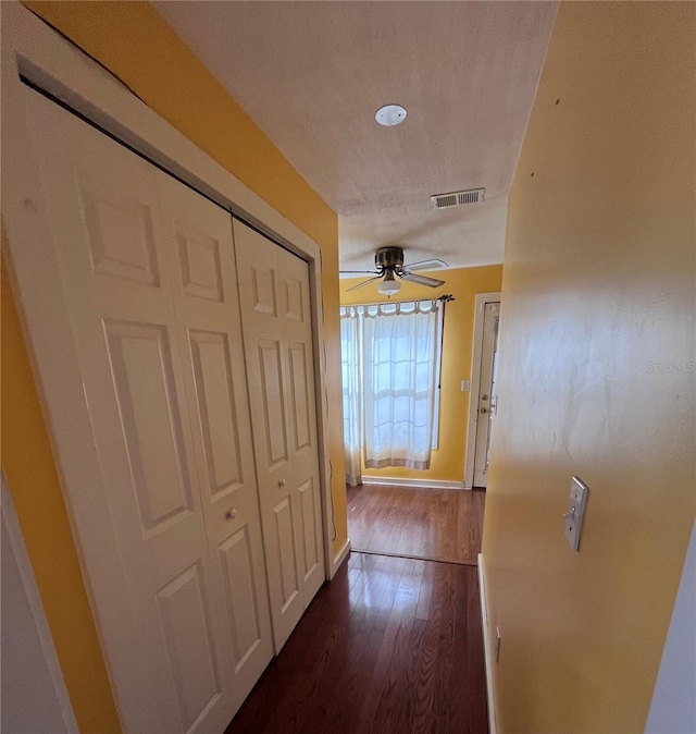 1319 Florida Ave, Saint Cloud, FL 34769 - hall with dark wood-style floors and baseboards