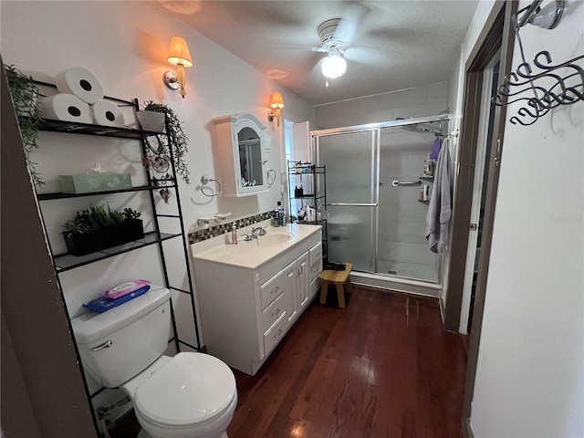 1319 Florida Ave, Saint Cloud, FL 34769 - bathroom with wood finished floors, vanity, a stall shower, and ceiling fan
