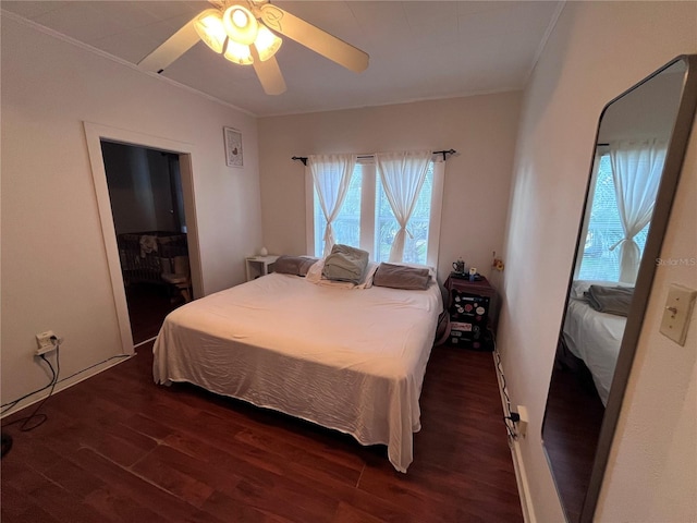 1319 Florida Ave, Saint Cloud, FL 34769 - bedroom with ornamental molding, wood finished floors, and a ceiling fan
