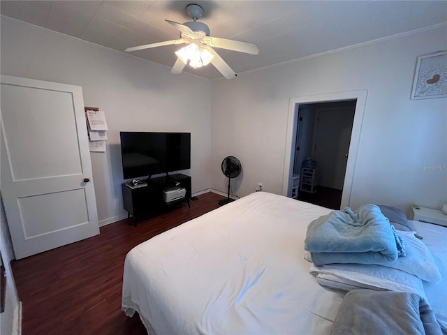 1319 Florida Ave, Saint Cloud, FL 34769 - bedroom featuring ornamental molding, dark wood-type flooring, and ceiling fan