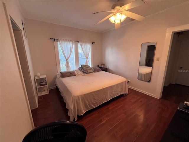 1319 Florida Ave, Saint Cloud, FL 34769 - bedroom with dark wood finished floors, crown molding, and a ceiling fan