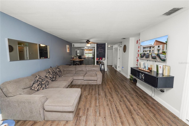 404 Country Ln NE Unit 404, Winter Haven, FL 33881 - living area featuring wood finished floors and a ceiling fan