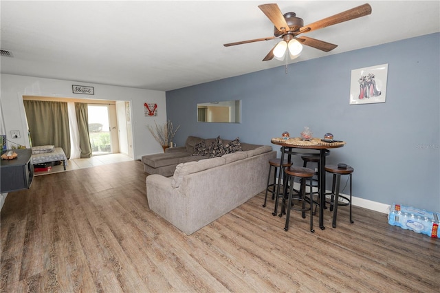 404 Country Ln NE Unit 404, Winter Haven, FL 33881 - living room with wood finished floors and ceiling fan