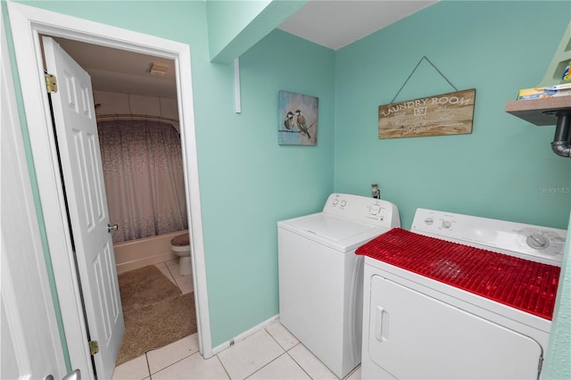 404 Country Ln NE Unit 404, Winter Haven, FL 33881 - laundry room featuring separate washer and dryer and light tile patterned flooring