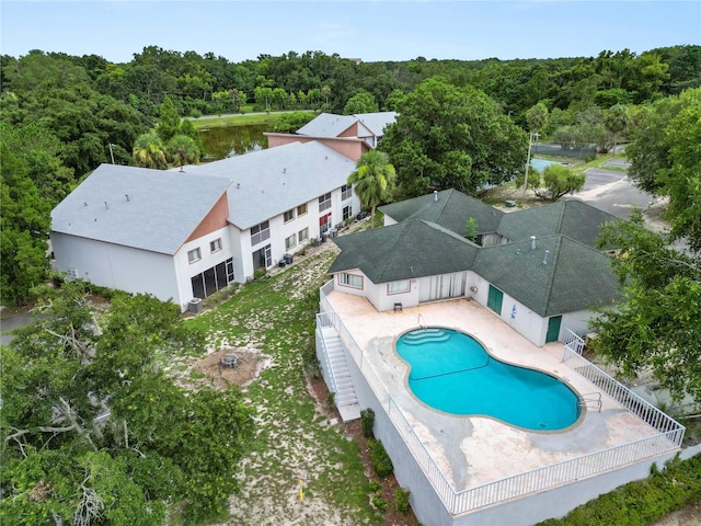 404 Country Ln NE Unit 404, Winter Haven, FL 33881 - view of swimming pool with a fenced backyard, a patio, and a forest view