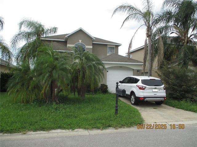 2881 Kokomo Loop, Haines City, FL 33844 - view of front of property with concrete driveway, an attached garage, stucco siding, and a shingled roof