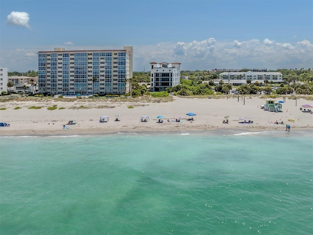 bird's eye view featuring a beach view and a water view