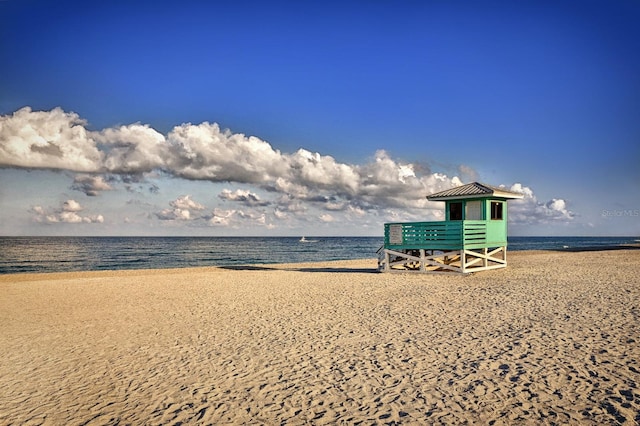 property view of water featuring a beach view