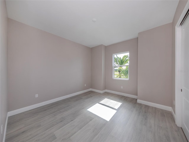 unfurnished room featuring light hardwood / wood-style flooring