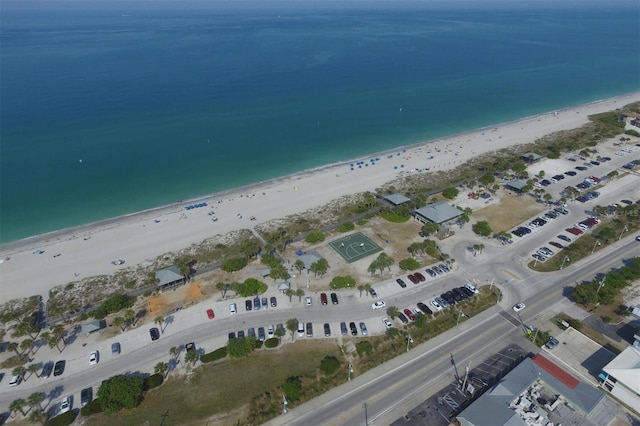 drone / aerial view featuring a view of the beach and a water view