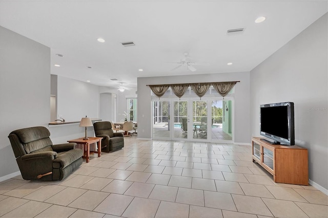 tiled living room with ceiling fan